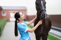 Woman veterinarian looks at the horse Royalty Free Stock Photo