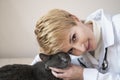 Woman veterinary show love and care towards pets, patient grey cat