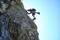 Woman on via ferrata steps at Suncuius, Romania. Adventure concept