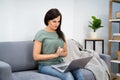 Woman Videoconferencing On Laptop