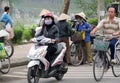 Woman in Vietnam wearing traditional triangular straw palm hats