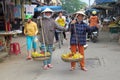 Woman in Vietnam wearing traditional triangular straw palm hats