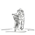 Woman in vietnamese conical hat walking with bicycle