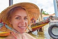 Woman with Vietnamese traditional hat sitting in the boat Royalty Free Stock Photo