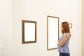 Woman viewing exposition in art gallery Royalty Free Stock Photo