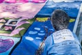 Woman Viewing Section of AIDS Quilt