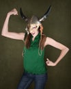 Woman in Viking Helmet Flexes Her Muscles