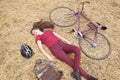 woman with vintage bike , backbag and helmet in hay