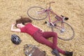 Woman with vintage bike , backbag and helmet in hay