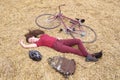 Woman with vintage bike , backbag and helmet in hay