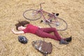 Woman with vintage bike , backbag and helmet in hay