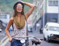 Woman, vintage bike and city travel for adventure on holiday break for explore, vacation or summer. Female person, retro Royalty Free Stock Photo