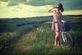 Woman with vintage bike outdoor, summer Tuscany