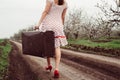 Woman in vintage clothes with suitcase Royalty Free Stock Photo