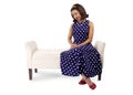 Woman in Vintage Dress and Furniture Looking at Something