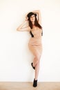 Woman, vintage fashion and pride in portrait, wall background and body for cool clothing. Female person, style and hat