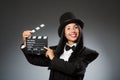 The woman with vintage hat and movie board