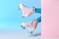 Woman with vintage roller skates on color background Royalty Free Stock Photo