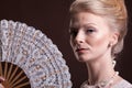 Woman in vintage victorian dress with a oriental fan in hand Royalty Free Stock Photo