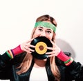 Woman with a vinyl record in 1980`s fashion Royalty Free Stock Photo