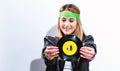 Woman with a vinyl record in 1980`s fashion Royalty Free Stock Photo