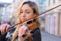 Woman violin player while eyes closed