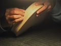 violin maker luthier hands roughing the edges of a raw blank violin with sandpaper