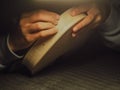 violin maker luthier hands roughing the edges of a raw blank violin with sandpaper