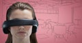 Woman in virtual reality headset against pink and grey hand drawn office Royalty Free Stock Photo