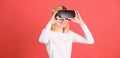 Woman with virtual reality headset. Portrait of young woman wearing VR goggles, experiencing virtual reality using 3d