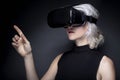 Woman with Virtual Reality Headset Touching Something