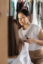 Woman visagist applying makeup cosmetic to female client getting ready. Make up artist working