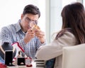 Woman visiting jeweler for jewelery evaluation