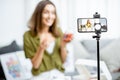 Woman vlogging about nutritional supplements Royalty Free Stock Photo