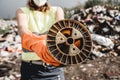 Woman volunteer helps clean the field of nuclear waste and plastic garbage