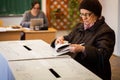 Woman voting at polling station