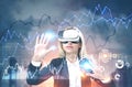 Woman in VR glasses, graphs, HUD and a city Royalty Free Stock Photo