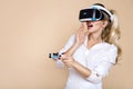 Woman with VR glasses of virtual reality. Young girl in virtual augmented reality helmet. VR headset. Royalty Free Stock Photo