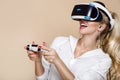 Woman with VR glasses of virtual reality. Young girl in virtual augmented reality helmet. VR headset. Royalty Free Stock Photo