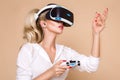 Woman with VR glasses of virtual reality. Young girl in virtual augmented reality helmet. VR headset. Royalty Free Stock Photo