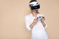 Woman with VR glasses of virtual reality. Young girl in virtual augmented reality helmet. VR headset. Royalty Free Stock Photo