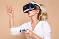 Woman with VR glasses of virtual reality. Young girl in virtual augmented reality helmet. VR headset. Royalty Free Stock Photo