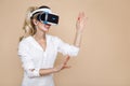 Woman with VR glasses of virtual reality. Young girl in virtual augmented reality helmet. VR headset. Royalty Free Stock Photo