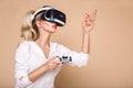 Woman with VR glasses of virtual reality. Young girl in virtual augmented reality helmet. VR headset. Royalty Free Stock Photo