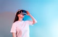 Woman with VR virtual reality goggles