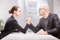 Woman vs man business arm wrestling Royalty Free Stock Photo