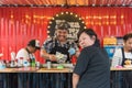 Woman wait for chef cooking a pizza and hamburger