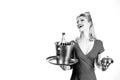 Woman waiter with champagne and service tray. Restaurant serving presentation.