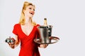 Woman waiter with champagne and service tray. Restaurant serving presentation.