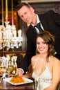 woman and waiter in fine dining restaurant Royalty Free Stock Photo